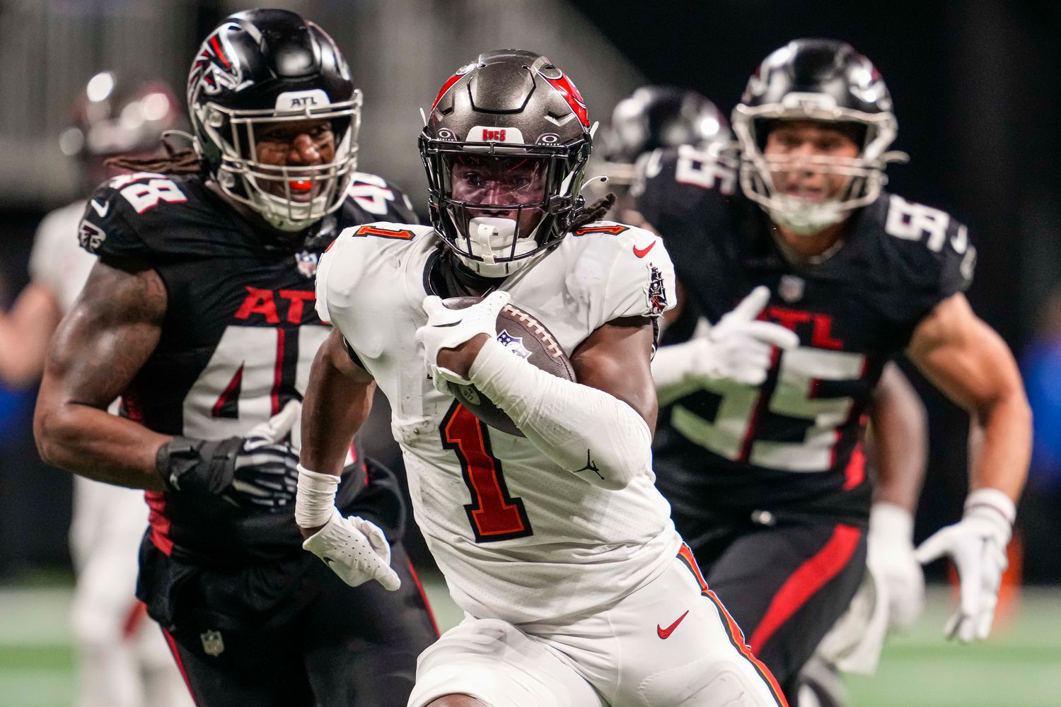 Tampa Bay Buccaneers running back Rachaad White (1) runs for a touchdown against the Atlanta Falcons during the second half at Mercedes-Benz Stadium.